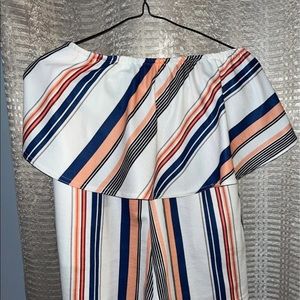 Bought from a boutique, white with colored stripes.